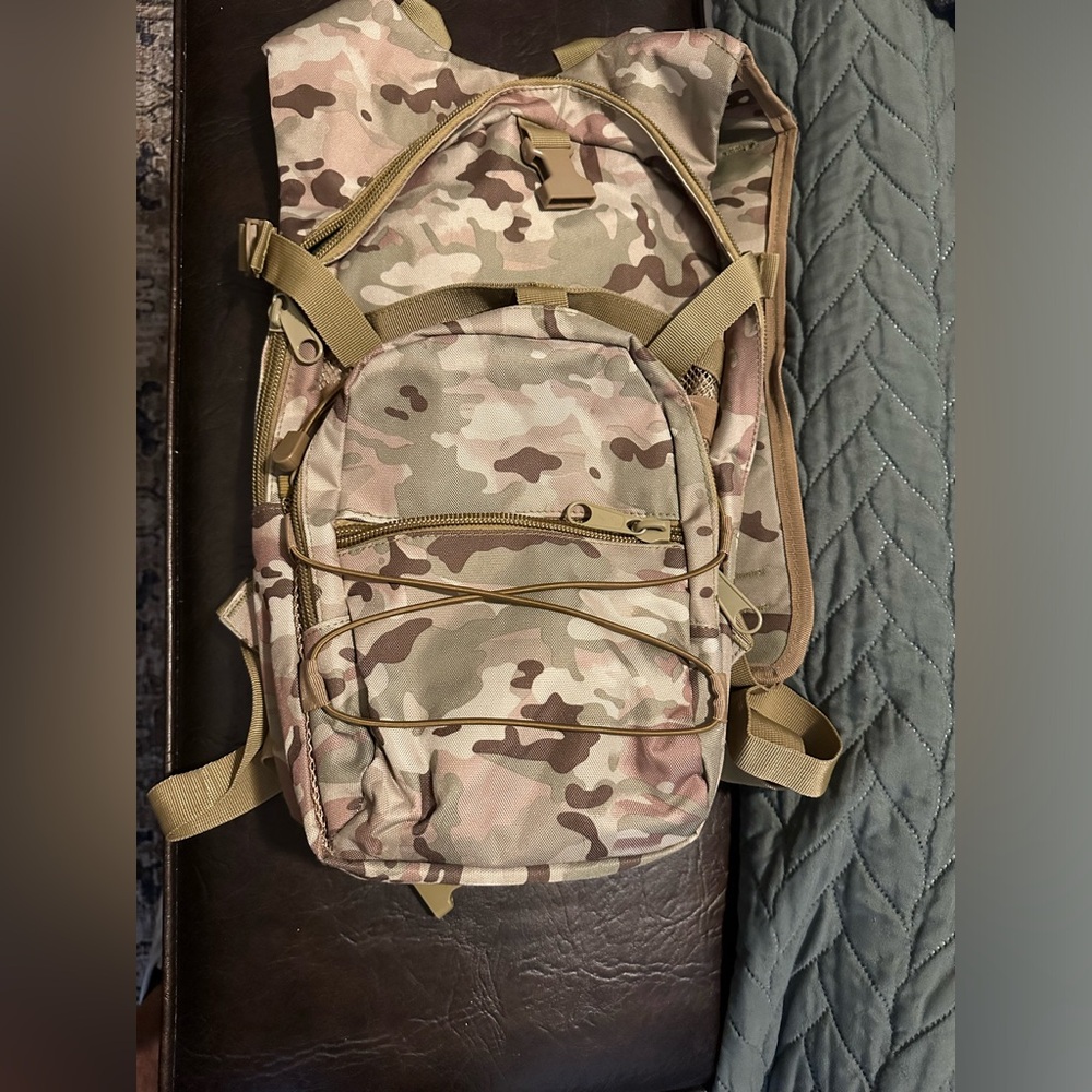 Multi-camouflage pattern hiking backpack.